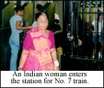 An Indian women enters the station for No. 7 train