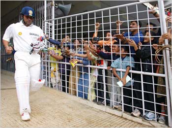Tendulkar walks out to bat