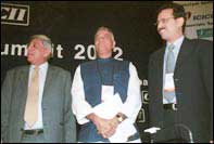 Finance Minister Yashwant Sinha, HDFC Chairman Deepak Parekh (L) and CII President Sanjiv Goenka (R) at the Banking Summit 2002 in Mumbai on Monday. 