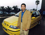 Sachin Tendulkar is seen posing in front of Palio. Photo: Reuters/Str