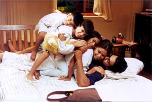 A still from Kannathil Muthamittal: Madhavan, Simran and the children