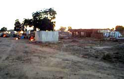 As evening approaches, fires are lit to provide light and warmth