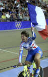 Felicia Ballanger does a lap of honour with the French flag. REUTERS/Eric Gaillard 