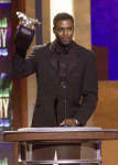Carl Lewis with the Sportsman of the Century award