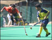 A Bharat Petroleum player takes evasive action. 