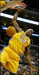 Shaquille O'Neal dunks against the New Jersey Nets 