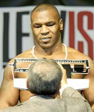 Mike Tyson weighs in for his title fight against champion Lennox Lewis